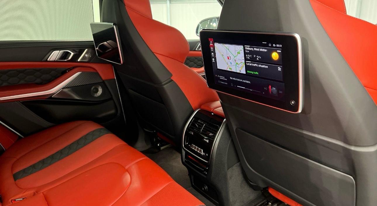 Red leather rear passenger interior with entertainment screen