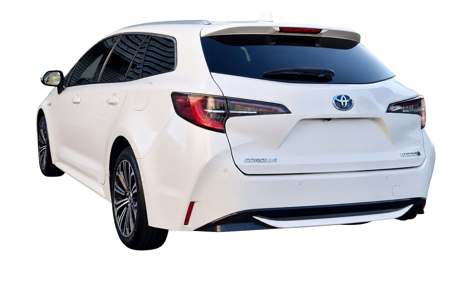 White Toyota Corolla Hybrid rear view with number plate removed